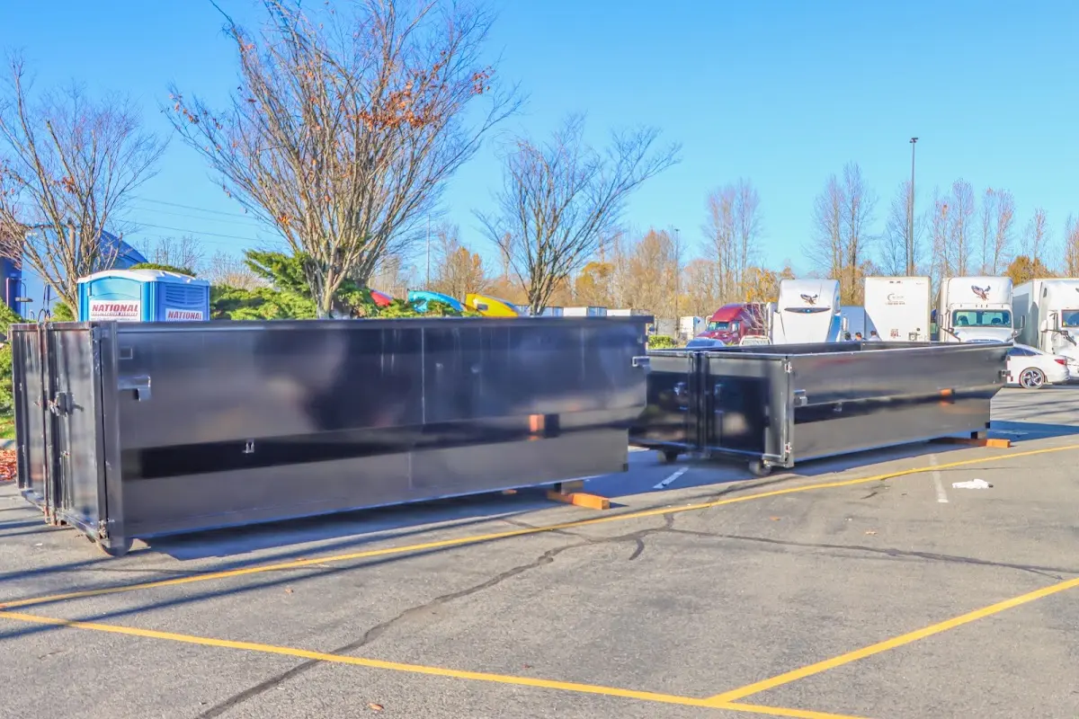 Professional dumpster rental service with roll-off container on residential driveway in Shaler